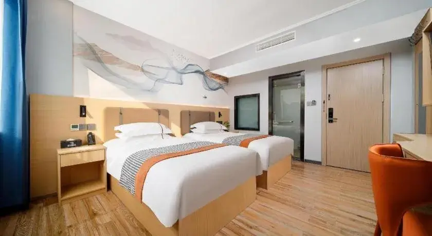 Bed in JIAN AI XI YUE HOTEL Bed in JIAN AI XI YUE HOTEL
