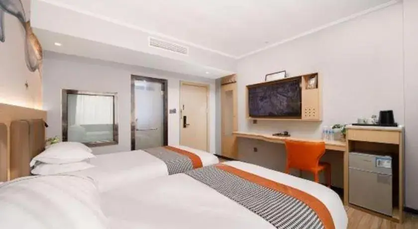 Bed in JIAN AI XI YUE HOTEL Bed in JIAN AI XI YUE HOTEL
