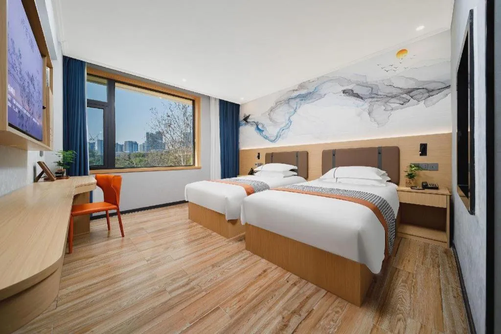 Bed in JIAN AI XI YUE HOTEL