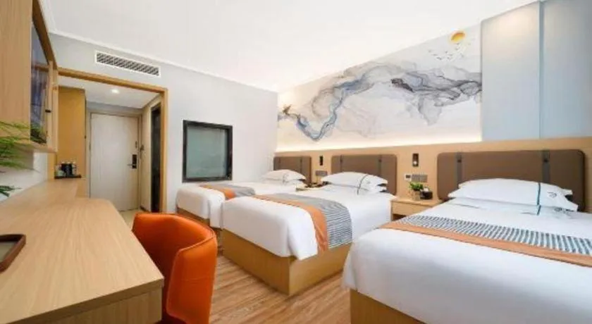 Bed in JIAN AI XI YUE HOTEL