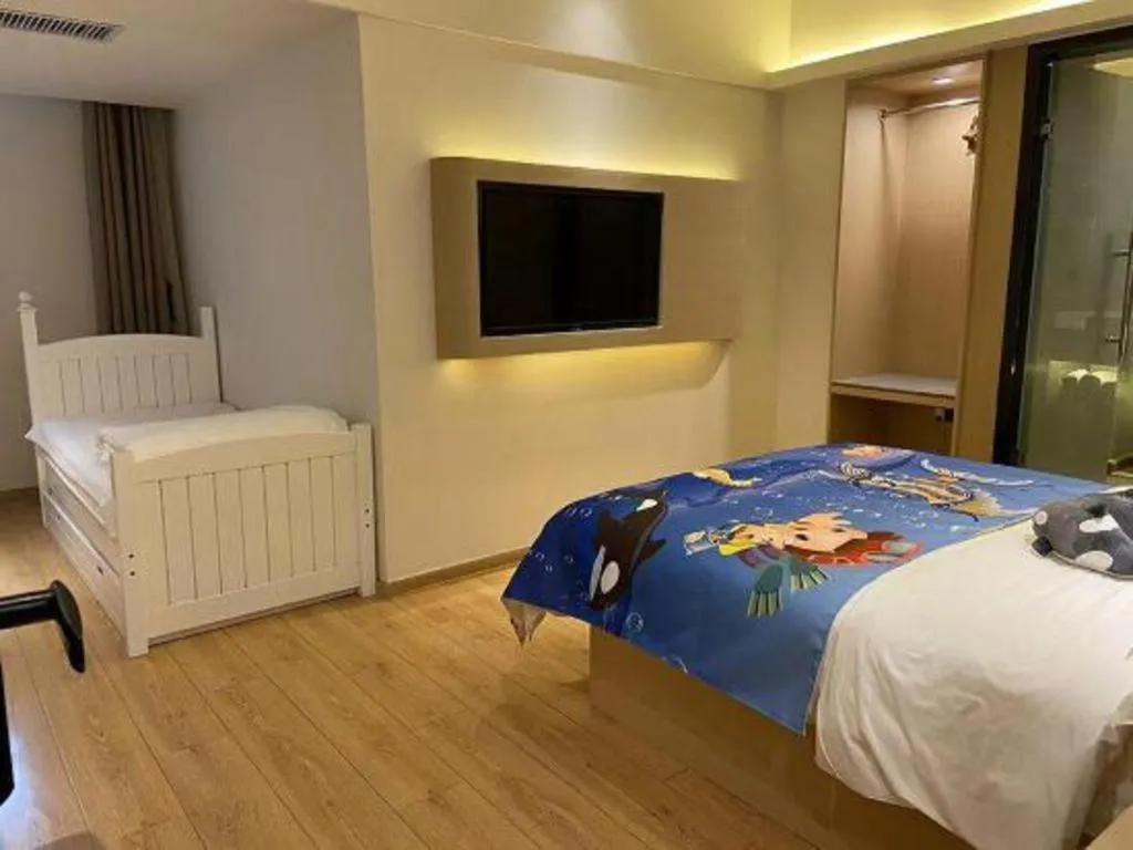 Bed in Metropolo Hotel Qingdao Wusi Square Xiaomaidao