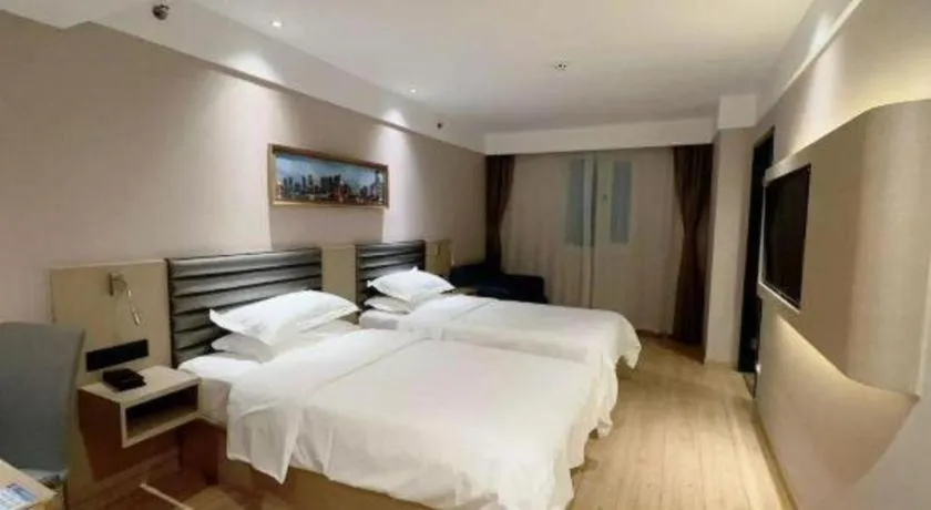 Bed in Metropolo Hotel Qingdao Wusi Square Xiaomaidao