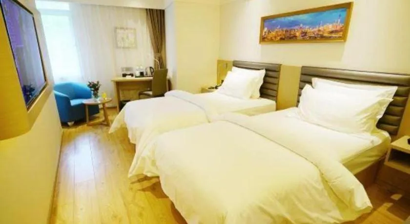 Bed in Metropolo Hotel Qingdao Wusi Square Xiaomaidao