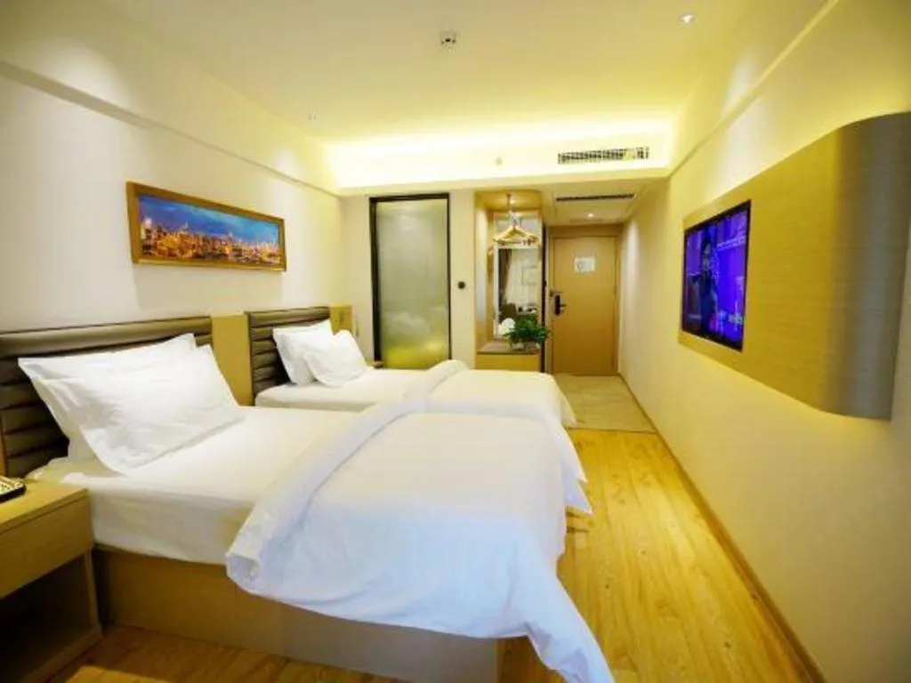 Bed in Metropolo Hotel Qingdao Wusi Square Xiaomaidao