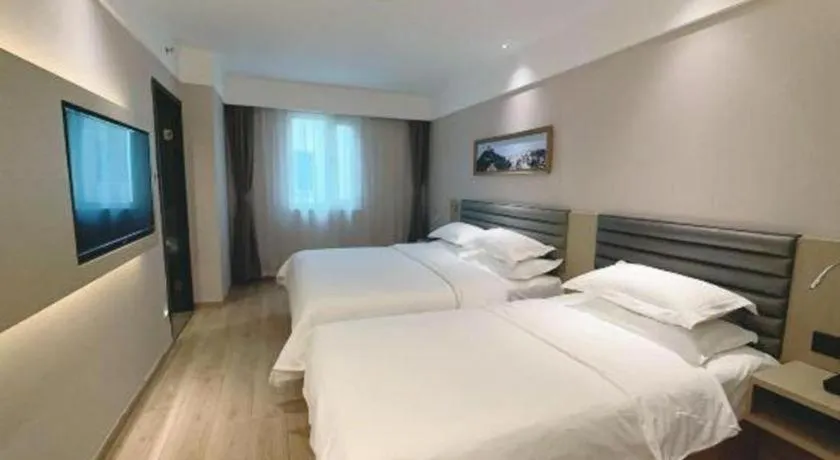 Bed in Metropolo Hotel Qingdao Wusi Square Xiaomaidao