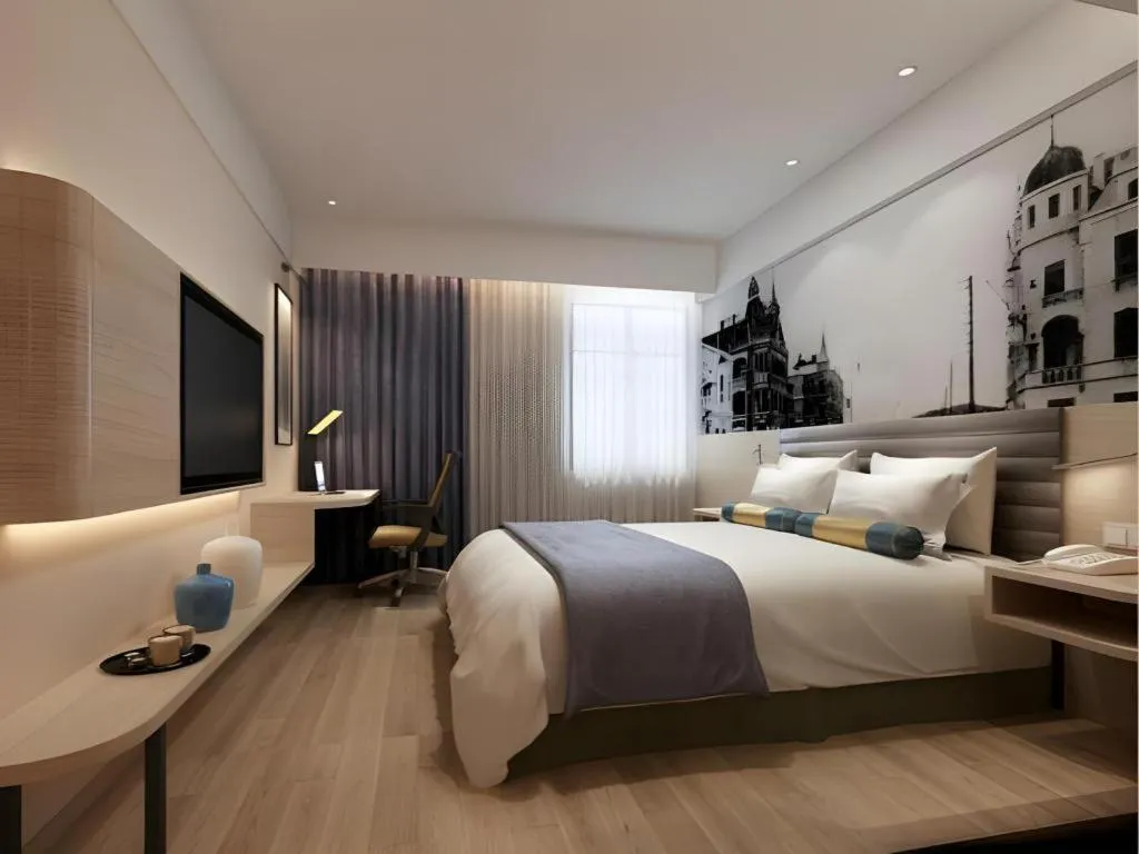 Bed in Metropolo Hotel Qingdao Wusi Square Xiaomaidao