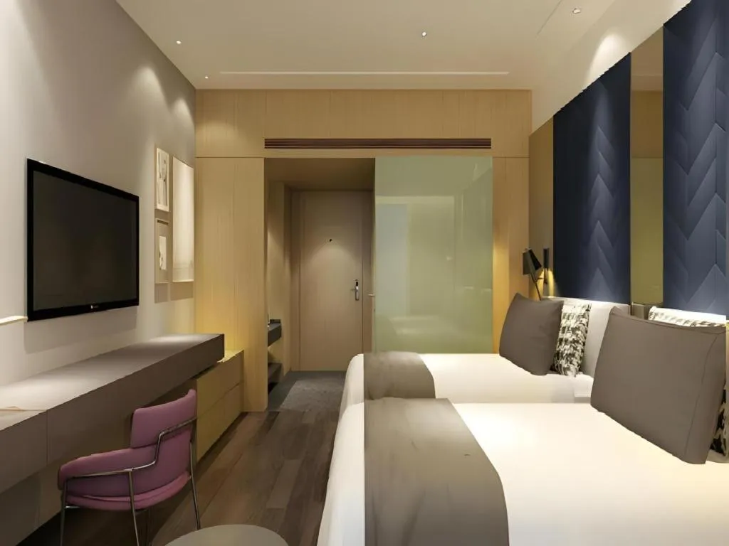 Bed in Metropolo Hotel Qingdao Wusi Square Xiaomaidao