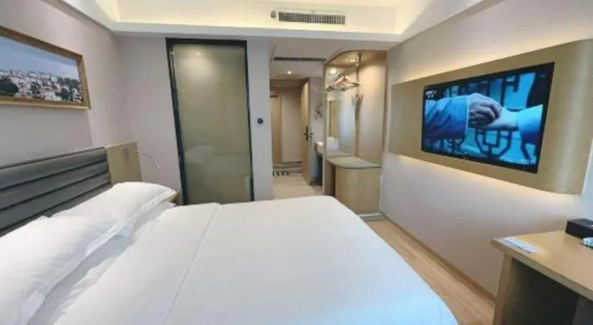 Bed in Metropolo Hotel Qingdao Wusi Square Xiaomaidao