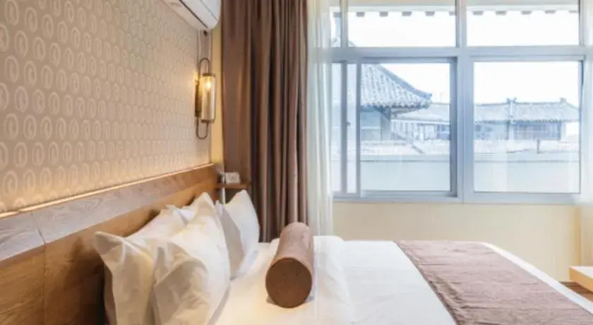 Bed in James Joyce Coffetel Qufu Tourist Center Gulou Street Sankong Scenic Spot Bed in James Joyce Coffetel Qufu Tourist Center Gulou Street Sankong Scenic Spot