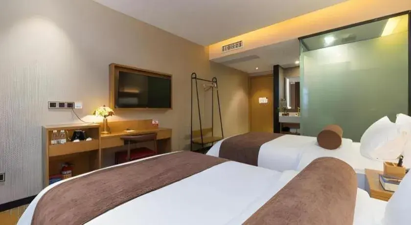 Bed in James Joyce Coffetel Guangzhou Dongxiaonan Metro Station Branch Bed in James Joyce Coffetel Guangzhou Dongxiaonan Metro Station Branch