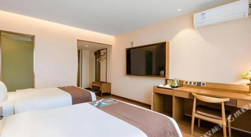 Bed in James Joyce Coffetel Xinyang Xixian Longhu Huayi