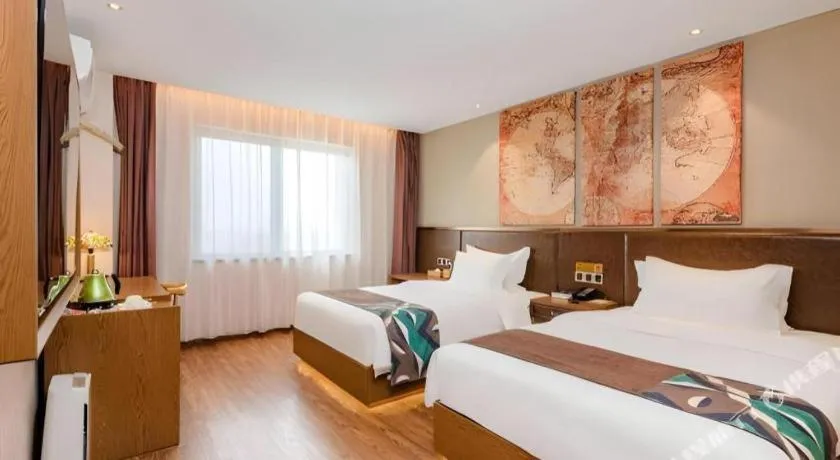 Bed in James Joyce Coffetel Xinyang Xixian Longhu Huayi