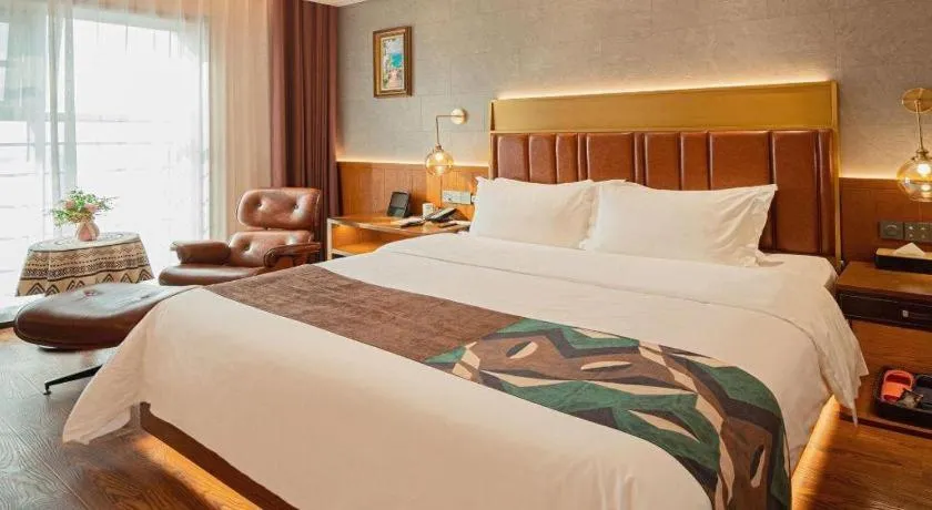 Bed in James Joyce Coffetel Xinyang Xixian Longhu Huayi