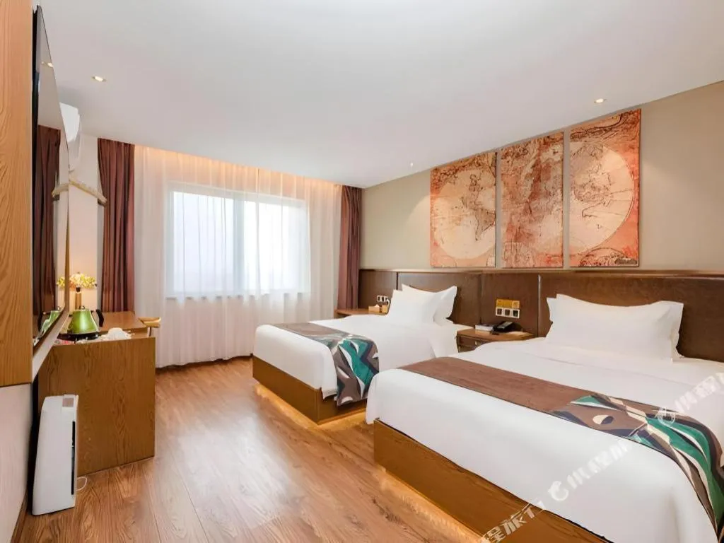 Bed in James Joyce Coffetel Xinyang Xixian Longhu Huayi