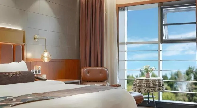 Bed in James Joyce Coffetel Xinyang Xixian Longhu Huayi