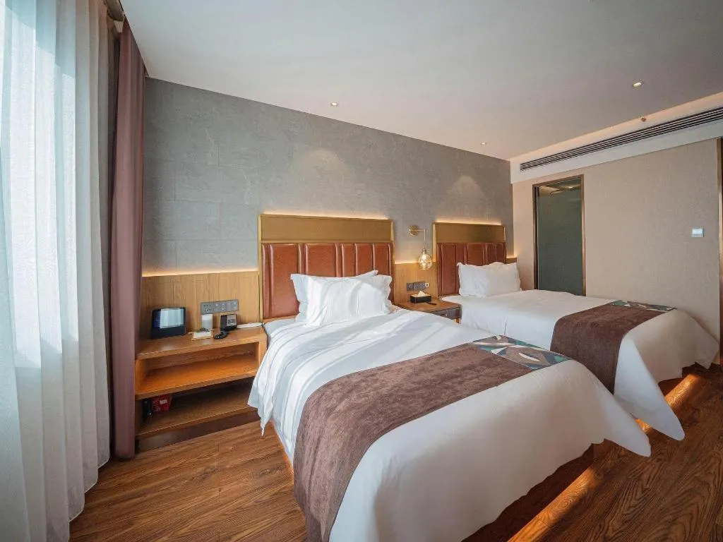 Bed in James Joyce Coffetel Xinyang Xixian Longhu Huayi