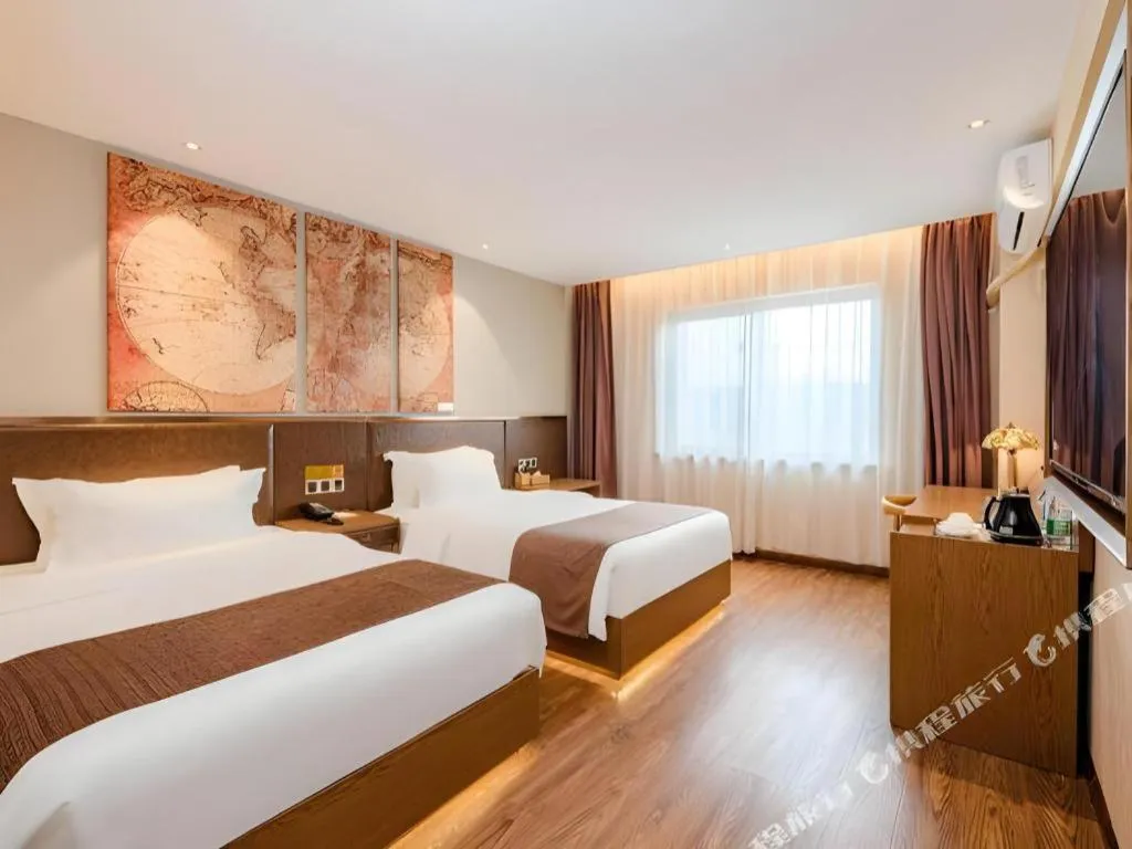 Bed in James Joyce Coffetel Xinyang Xixian Longhu Huayi