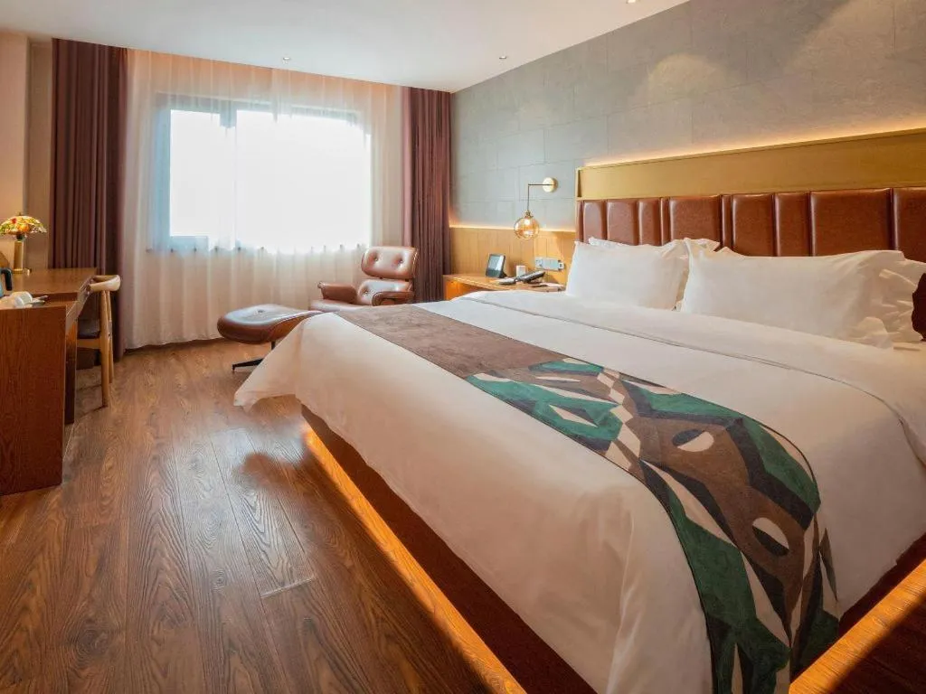 Bed in James Joyce Coffetel Xinyang Xixian Longhu Huayi