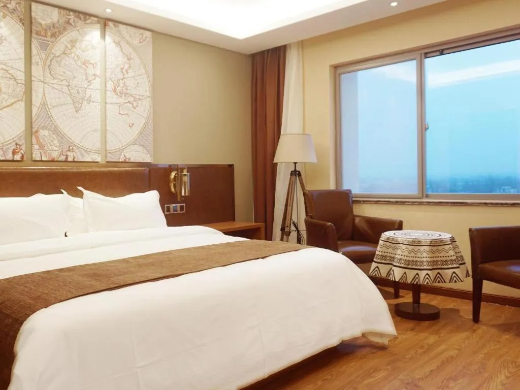 Bed in James Joyce Coffetel Xinyang Xixian Longhu Huayi