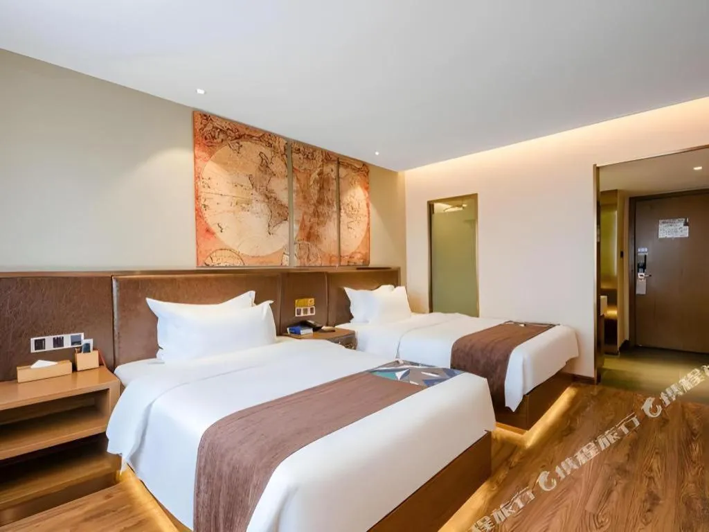 Bed in James Joyce Coffetel Xinyang Xixian Longhu Huayi