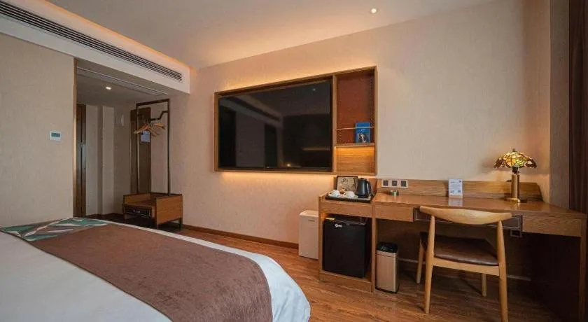 Bed in James Joyce Coffetel Xinyang Xixian Longhu Huayi