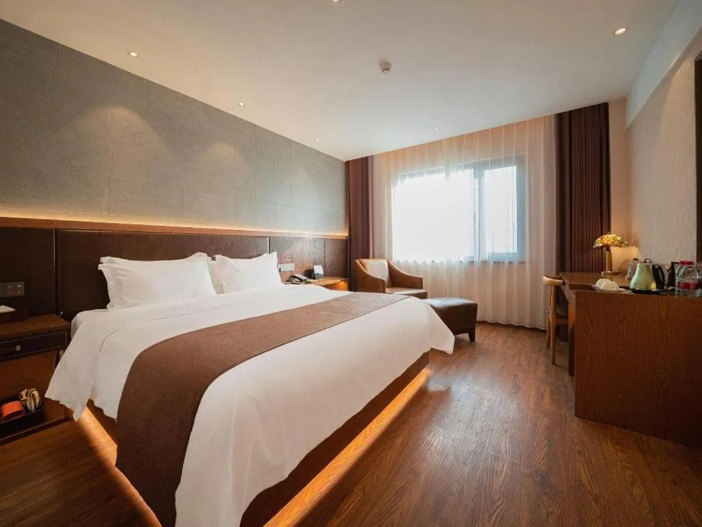 Bed in James Joyce Coffetel Xinyang Xixian Longhu Huayi