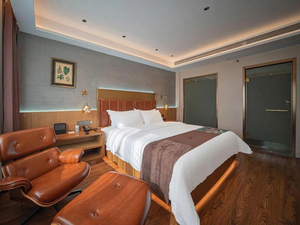 Bed in James Joyce Coffetel Xinyang Xixian Longhu Huayi