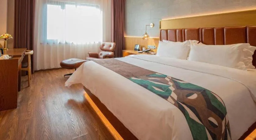 Bed in James Joyce Coffetel Xinyang Xixian Longhu Huayi