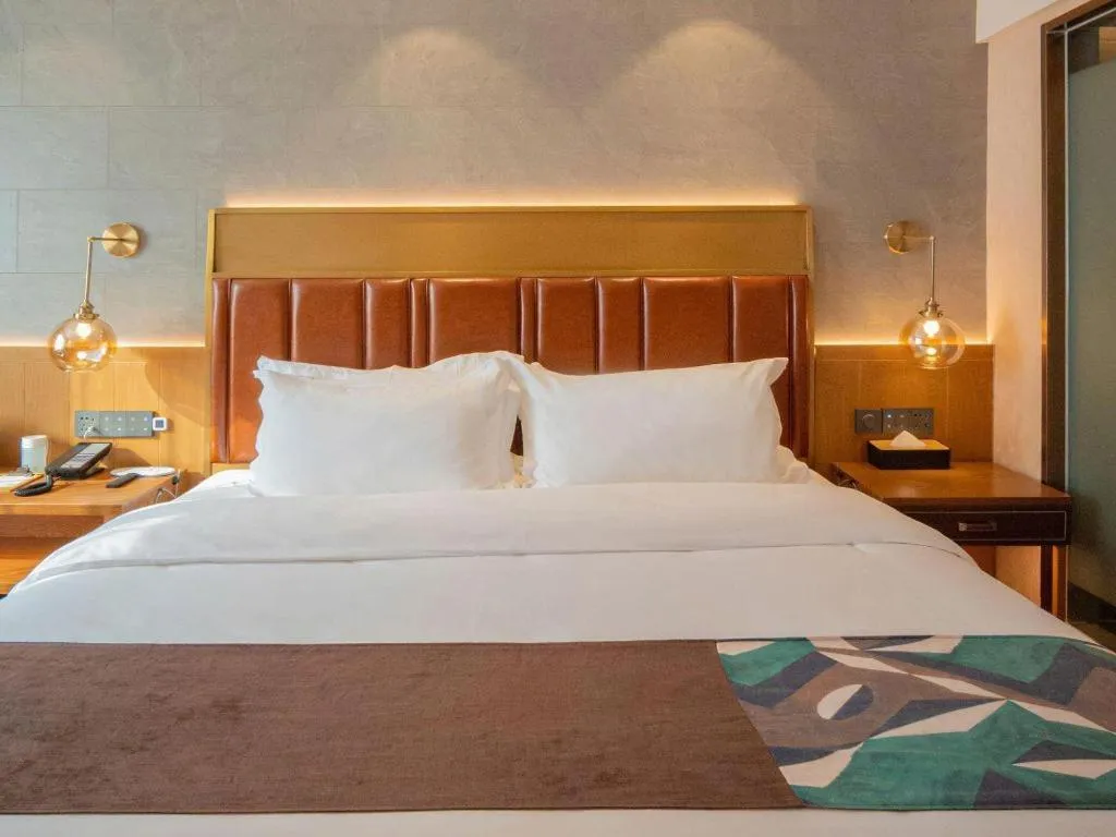 Bed in James Joyce Coffetel Xinyang Xixian Longhu Huayi