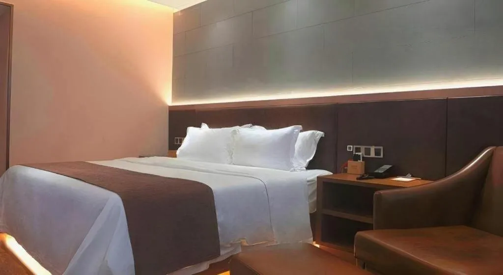 Bed in James Joyce Coffetel Xinyang Xixian Longhu Huayi