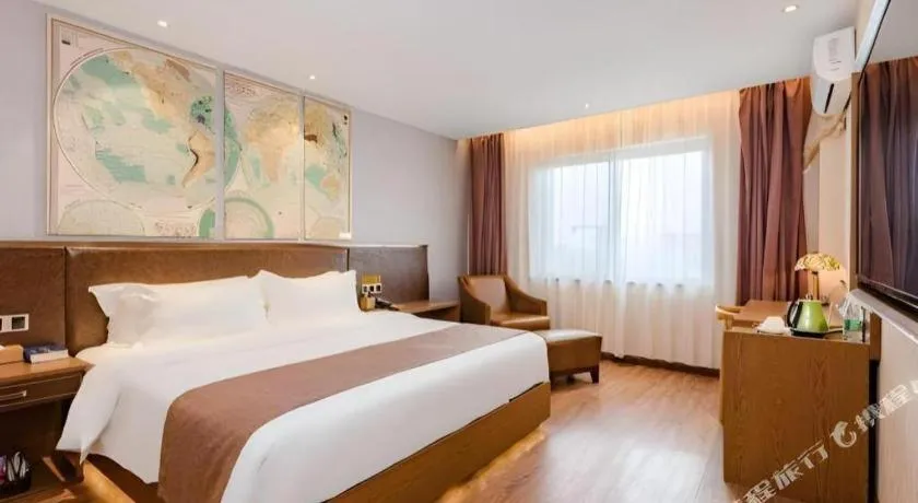 Bed in James Joyce Coffetel Xinyang Xixian Longhu Huayi