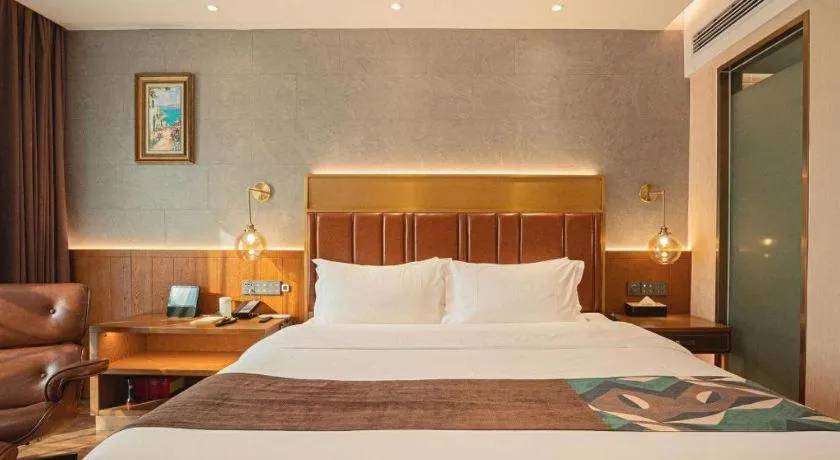 Bed in James Joyce Coffetel Xinyang Xixian Longhu Huayi