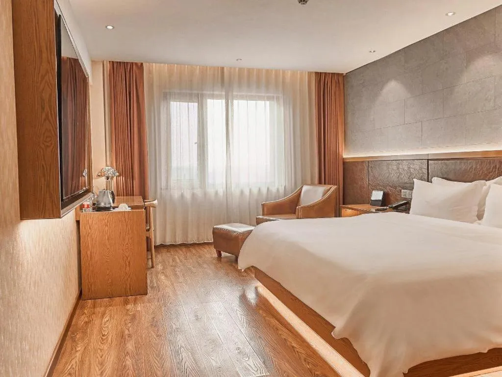 Bed in James Joyce Coffetel Xinyang Xixian Longhu Huayi