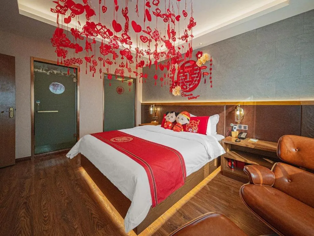 Bed in James Joyce Coffetel Xinyang Xixian Longhu Huayi