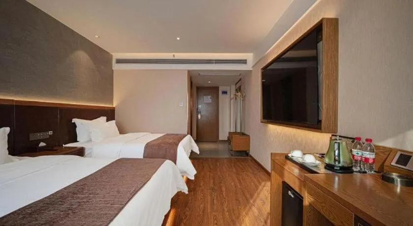 Bed in James Joyce Coffetel Xinyang Xixian Longhu Huayi