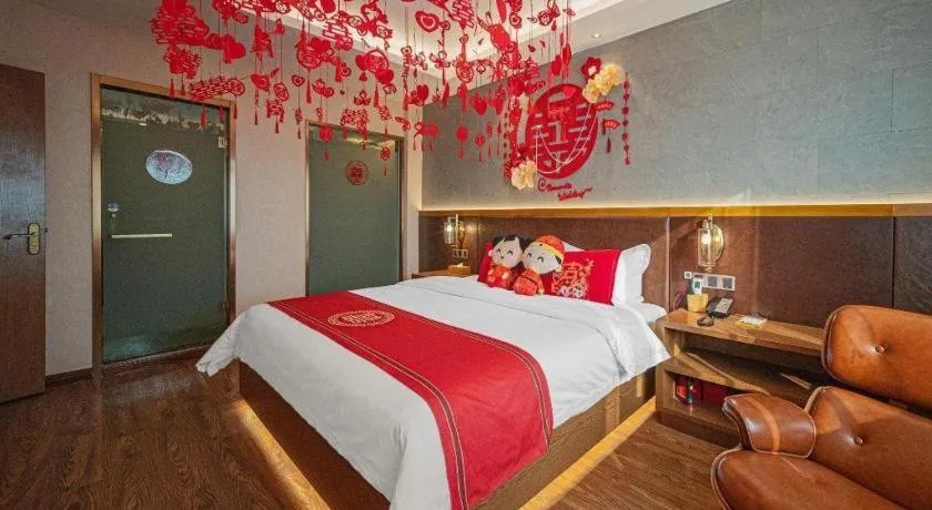 Bed in James Joyce Coffetel Xinyang Xixian Longhu Huayi