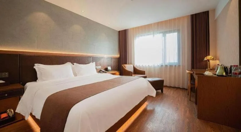 Bed in James Joyce Coffetel Xinyang Xixian Longhu Huayi