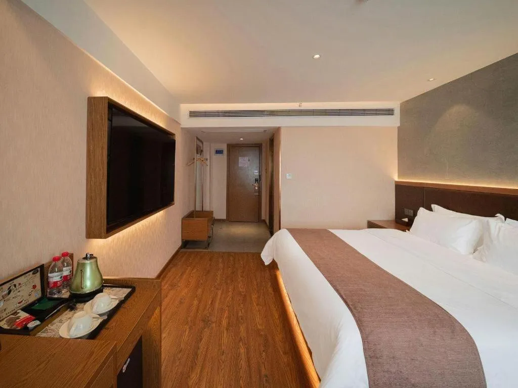 Bed in James Joyce Coffetel Xinyang Xixian Longhu Huayi