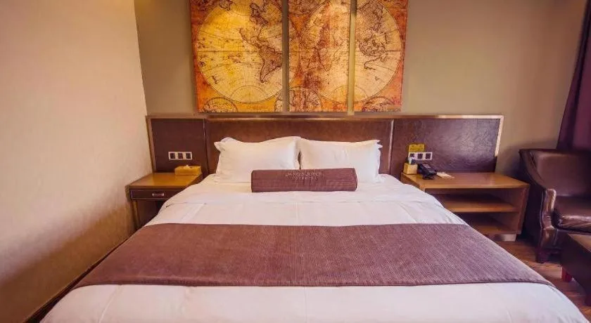 Bed in James Joyce Coffetel Xinyang Xixian Longhu Huayi