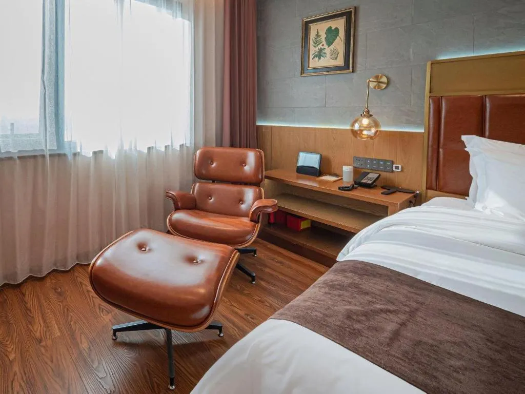 Bed in James Joyce Coffetel Xinyang Xixian Longhu Huayi