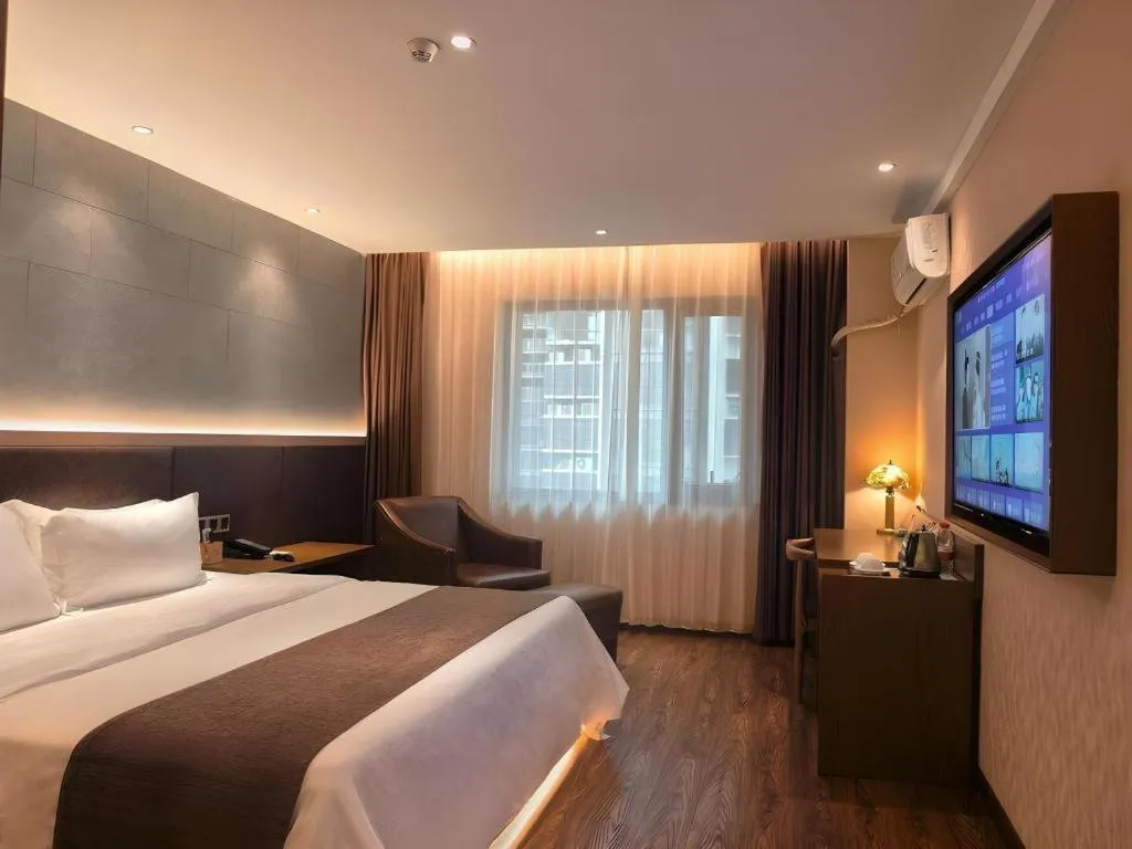 Bed in James Joyce Coffetel Xinyang Xixian Longhu Huayi