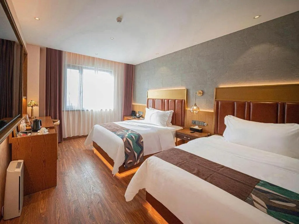 Bed in James Joyce Coffetel Xinyang Xixian Longhu Huayi