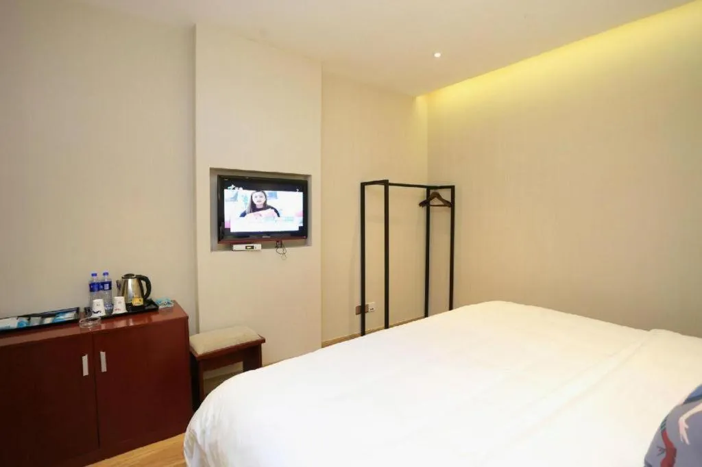 Bed in PAI Hotel Guangzhou North Gate of Chimelong Zoo