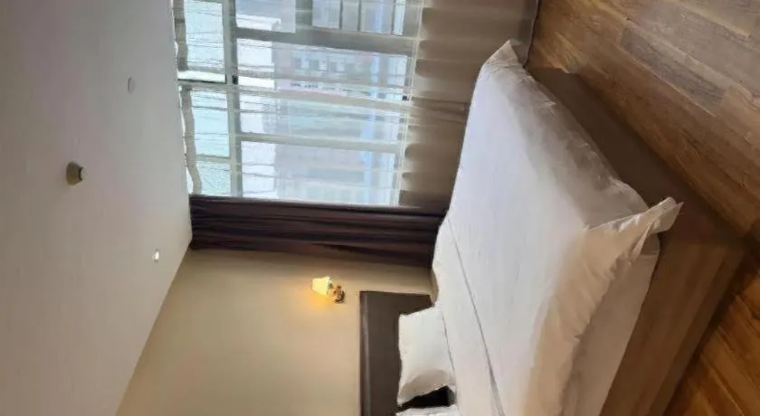 Bed in PAI Hotel Guangzhou North Gate of Chimelong Zoo