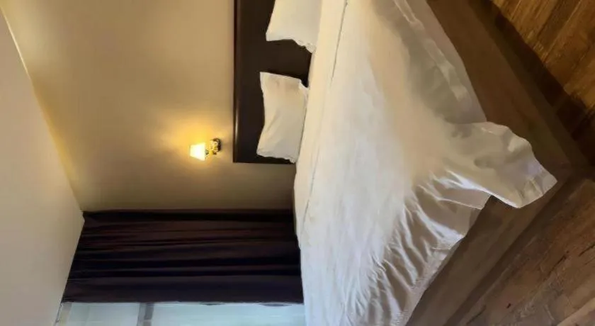 Bed in PAI Hotel Guangzhou North Gate of Chimelong Zoo