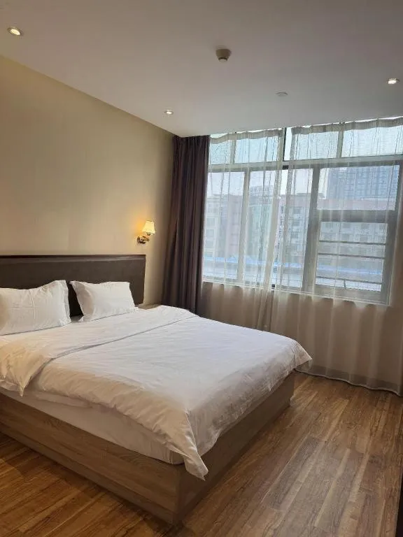 Bed in PAI Hotel Guangzhou North Gate of Chimelong Zoo