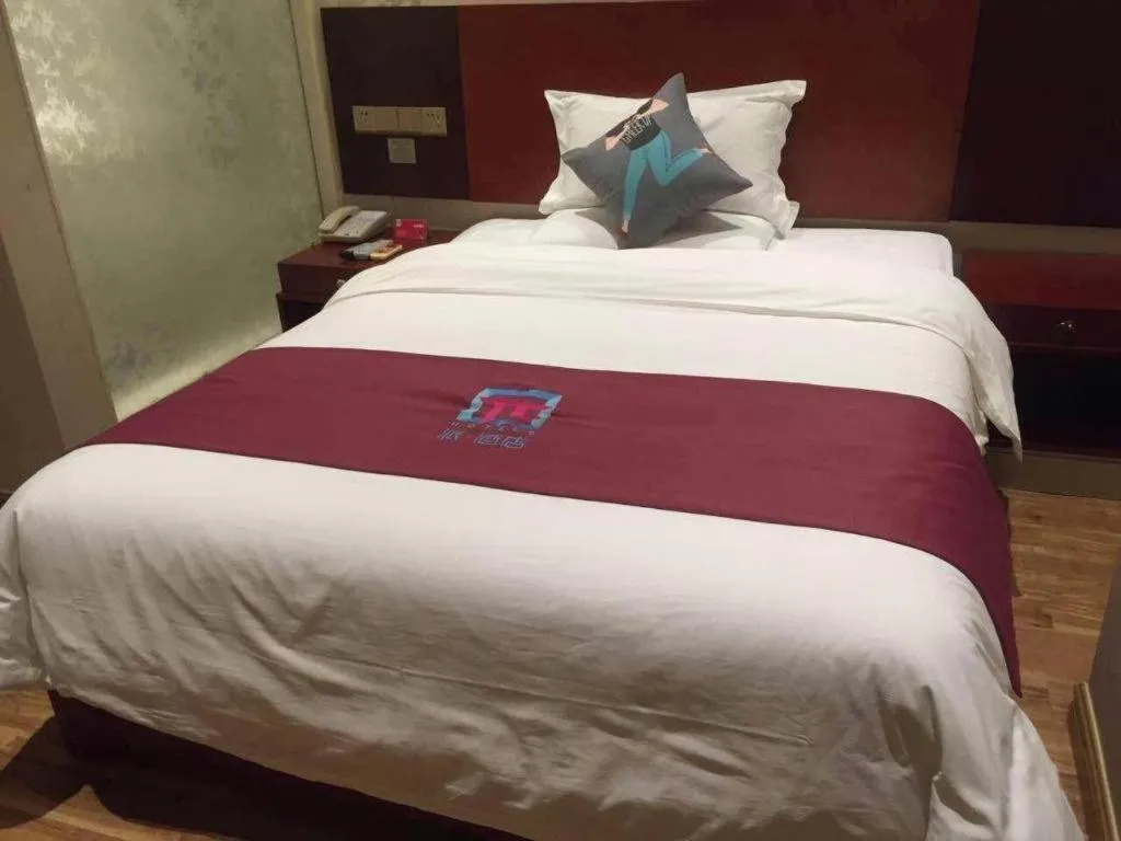 Bed in PAI Hotel Guangzhou North Gate of Chimelong Zoo