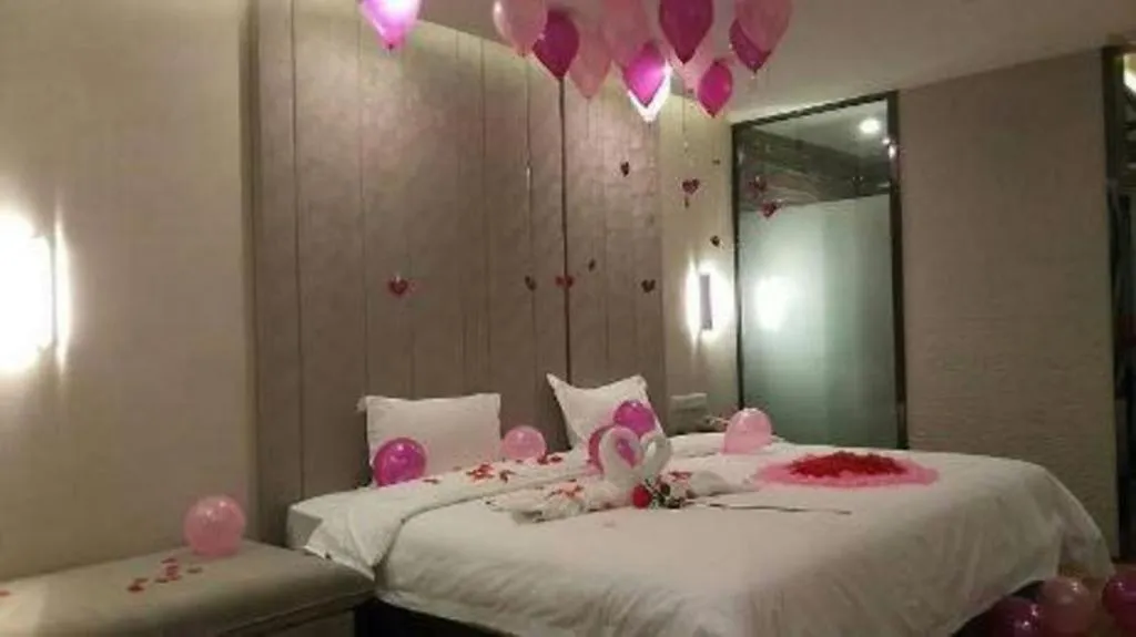 Bed in PAI Hotel Guangzhou North Gate of Chimelong Zoo