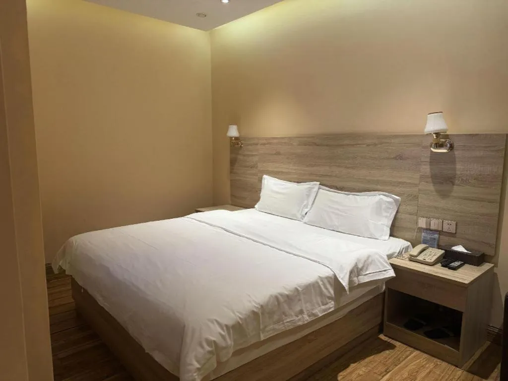 Bed in PAI Hotel Guangzhou North Gate of Chimelong Zoo