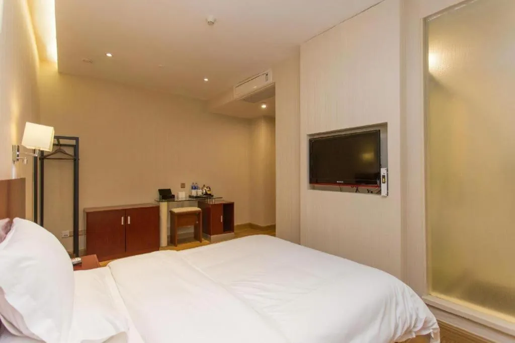 Bed in PAI Hotel Guangzhou North Gate of Chimelong Zoo